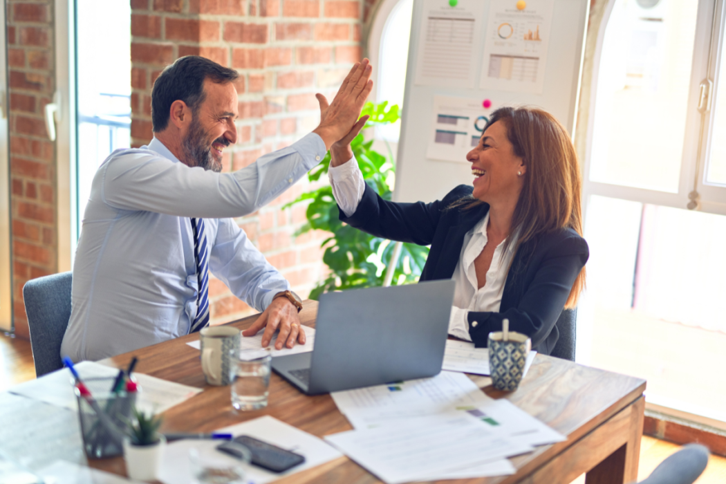 Business people happy with their outsourcing decision